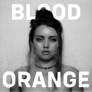 album cover art displaying Jayli Wolf for their single "Blood Orange"