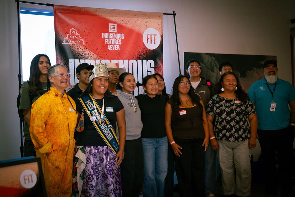 Students, chaperones and organizers gather in front of the Indigenous Fashion 4EVER backdrop. Photo by The Berry Pickers.