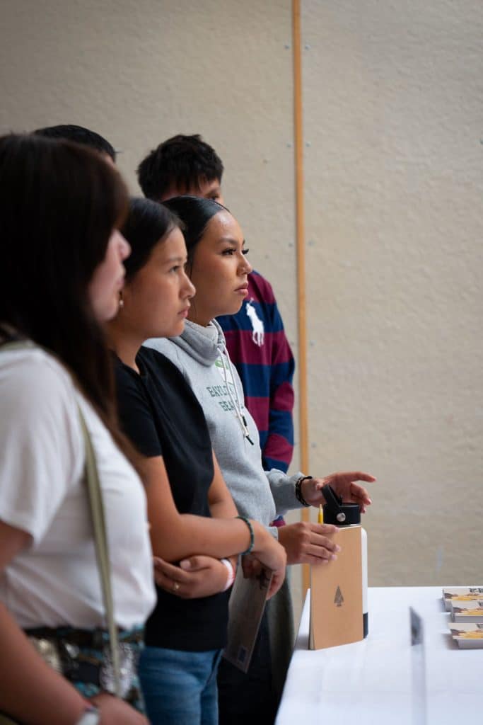 Indigenous students standing together during the Indigenous Fashion 4EVER gathering. Photo by The Berry Pickers.