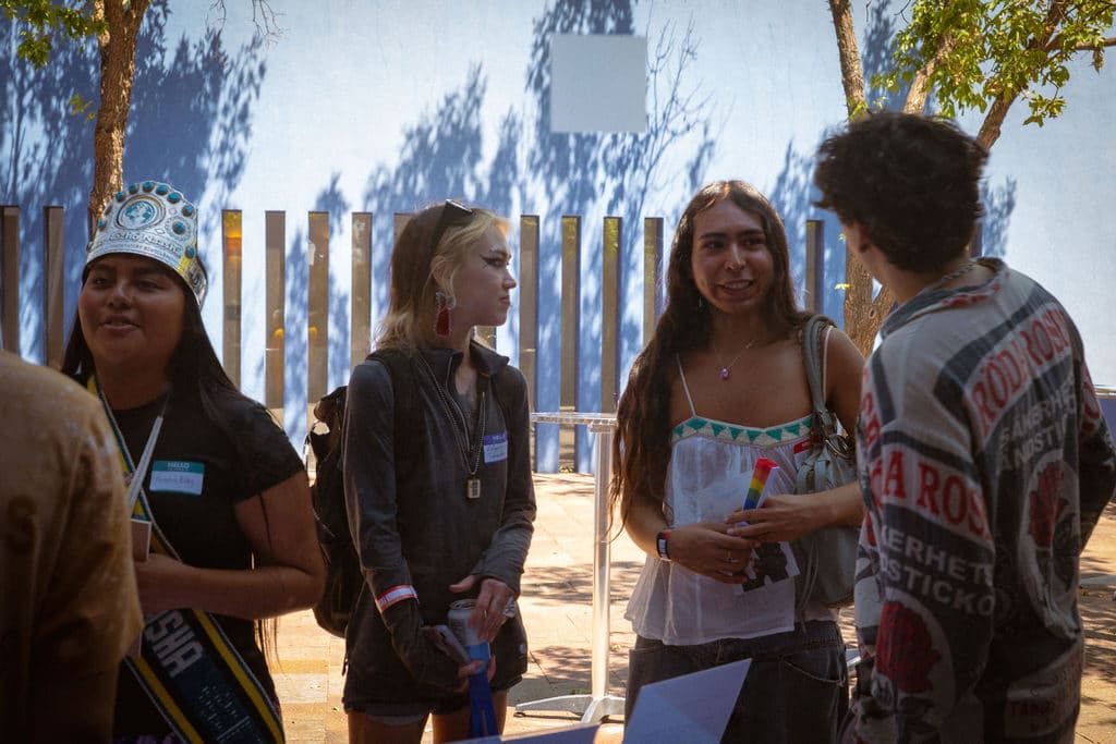 Students talk together in the courtyard at the Santa Fe Art Institute. Photo by The Berry Pickers.