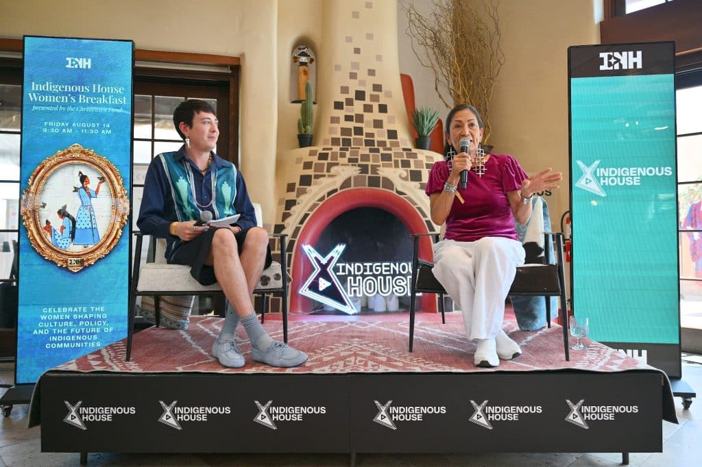 Former Secretary of the Interior and New Mexico Democratic Gubernatorial candidate Deb Haaland (R) speaks during an interview with Senior Fashion and Style Writer at Vogue Christian Allaire (R) at the Indigenous House Women's Networking Breakfast on August 14, 2026 in Santa Fe, New Mexico.