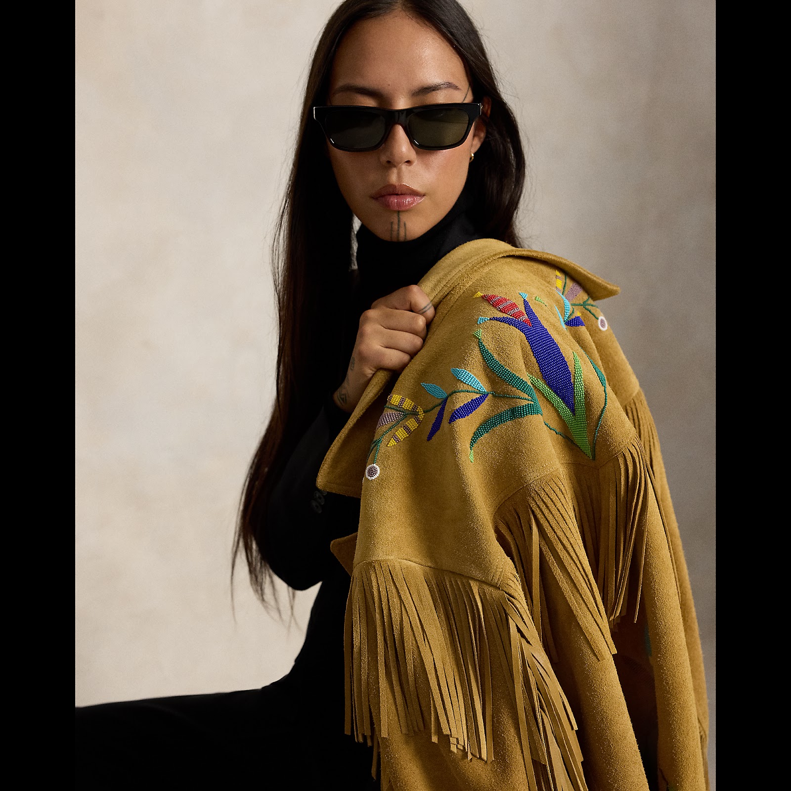 Quannah ChasingHorse wearing the beaded and fringed Shimmering Sage Jacket from the Polo Ralph Lauren x TÓPA collection.