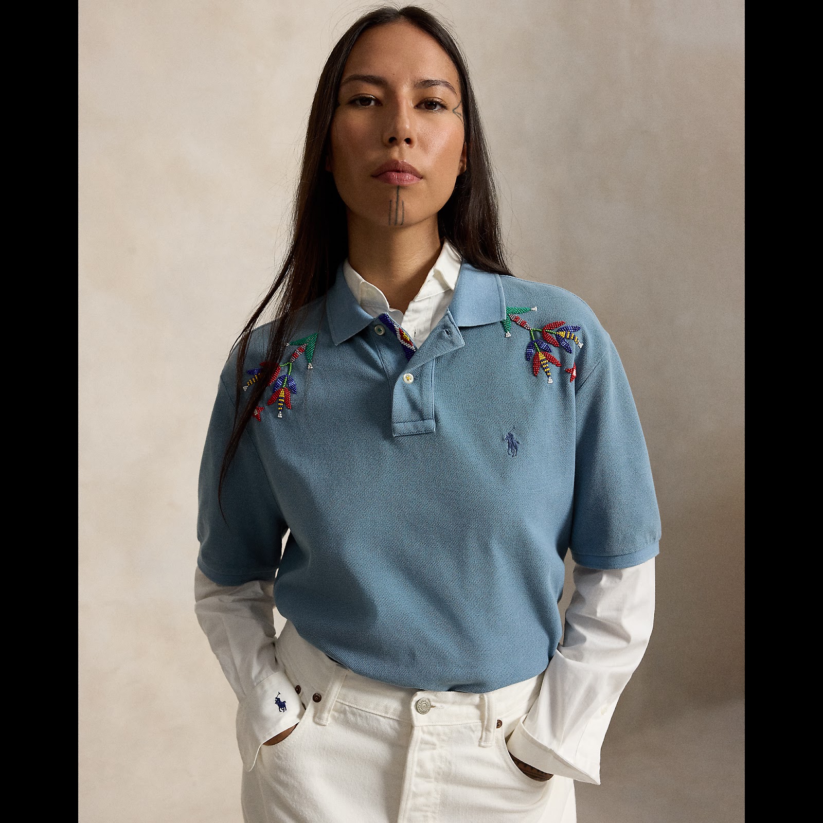 Quannah ChasingHorse wearing the hand-beaded Singing Blossoms Polo Shirt from Polo Ralph Lauren x TÓPA.